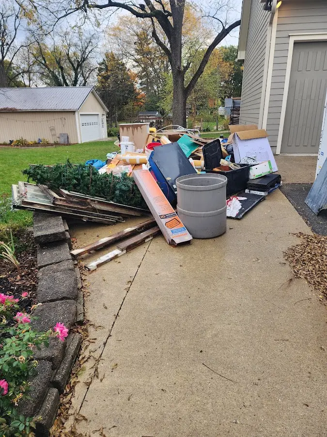 Dumpster being loaded with debris for 3 Yard Dumpster Rental in Villa Park